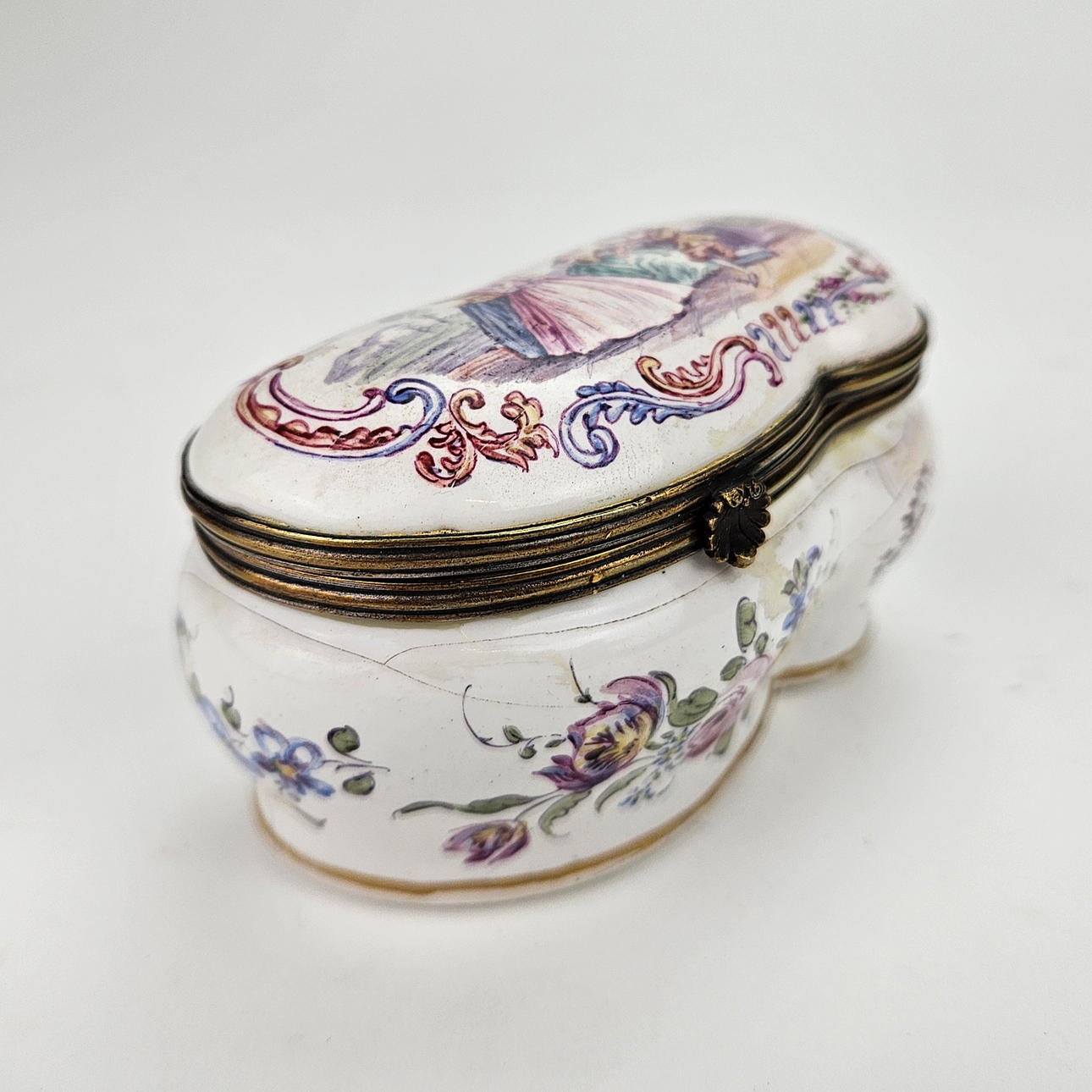 A ceramic box, Rococo style, dated Lille 1763.