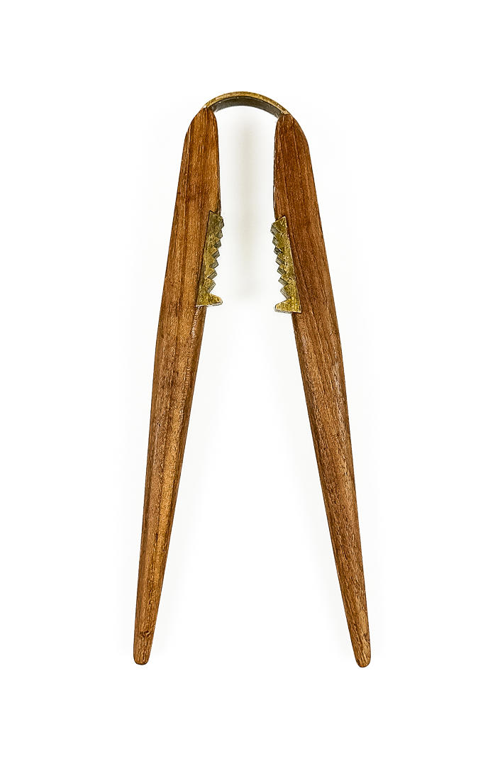 CARL AUBÖCK. A teak nutcracker, brass, Austria, mid 20th century.