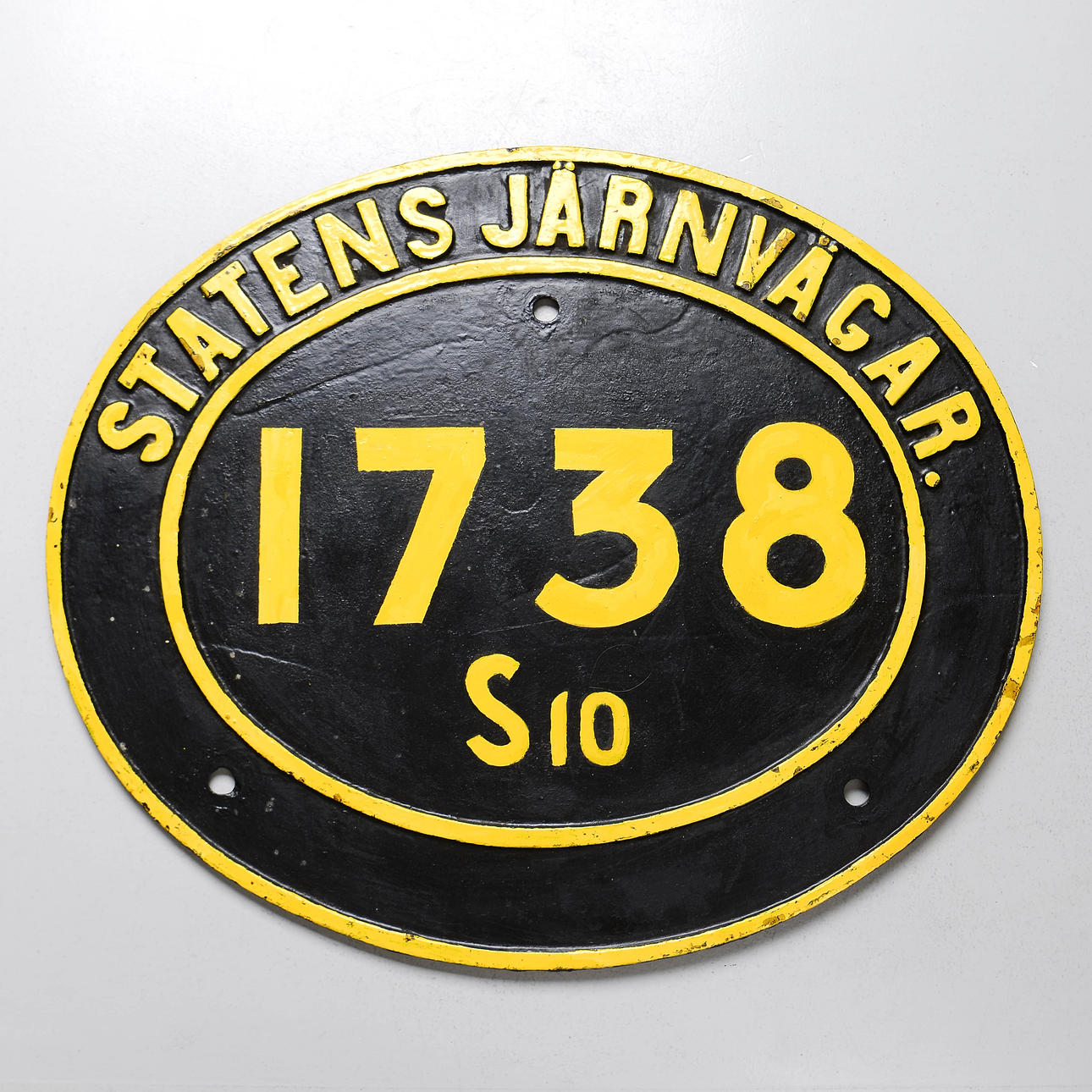 SEÑAL DE LOCOMOTORA DE HIERRO FUNDIDO.