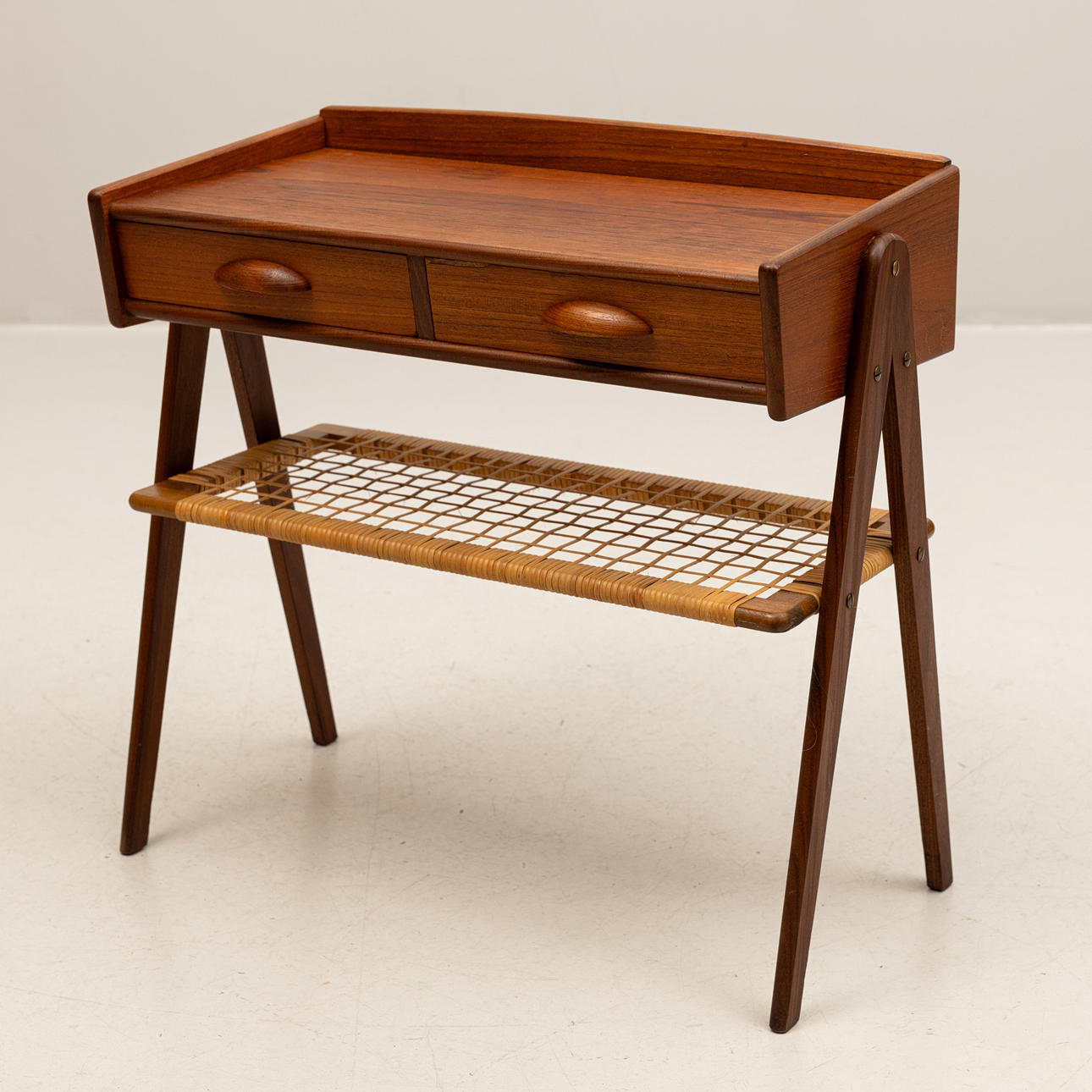 A teak hall table from Denmark, mid 20th century.