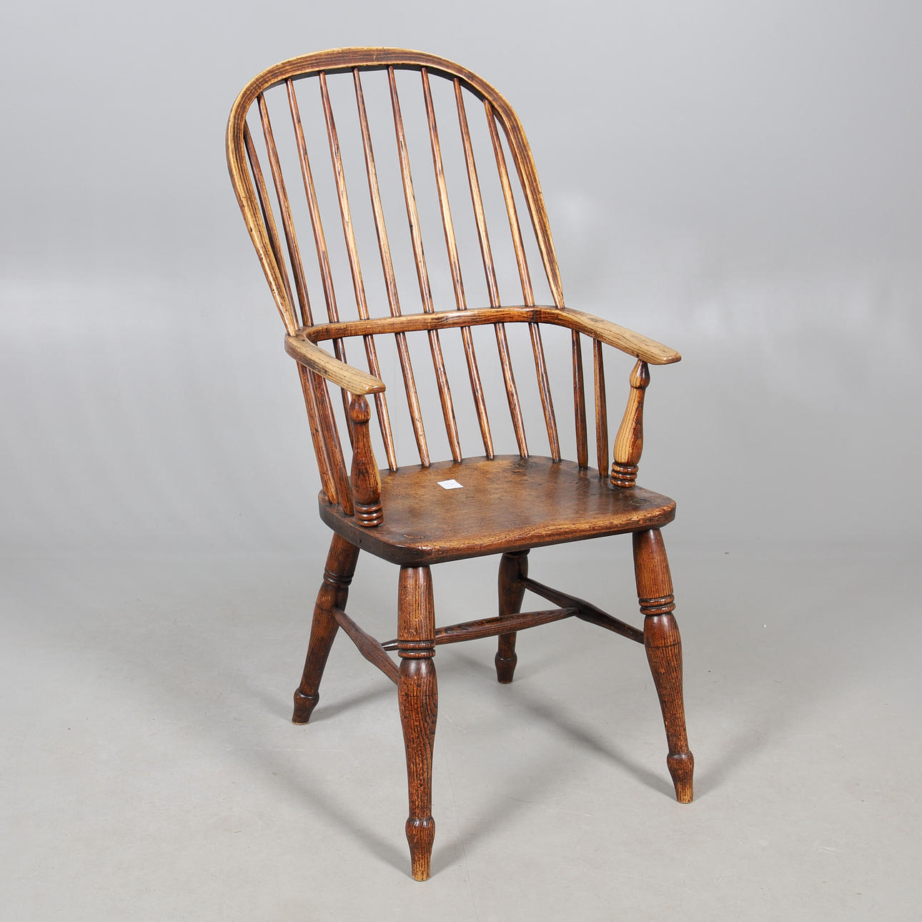 OAK STICK BACK ELBOW ARMCHAIR.