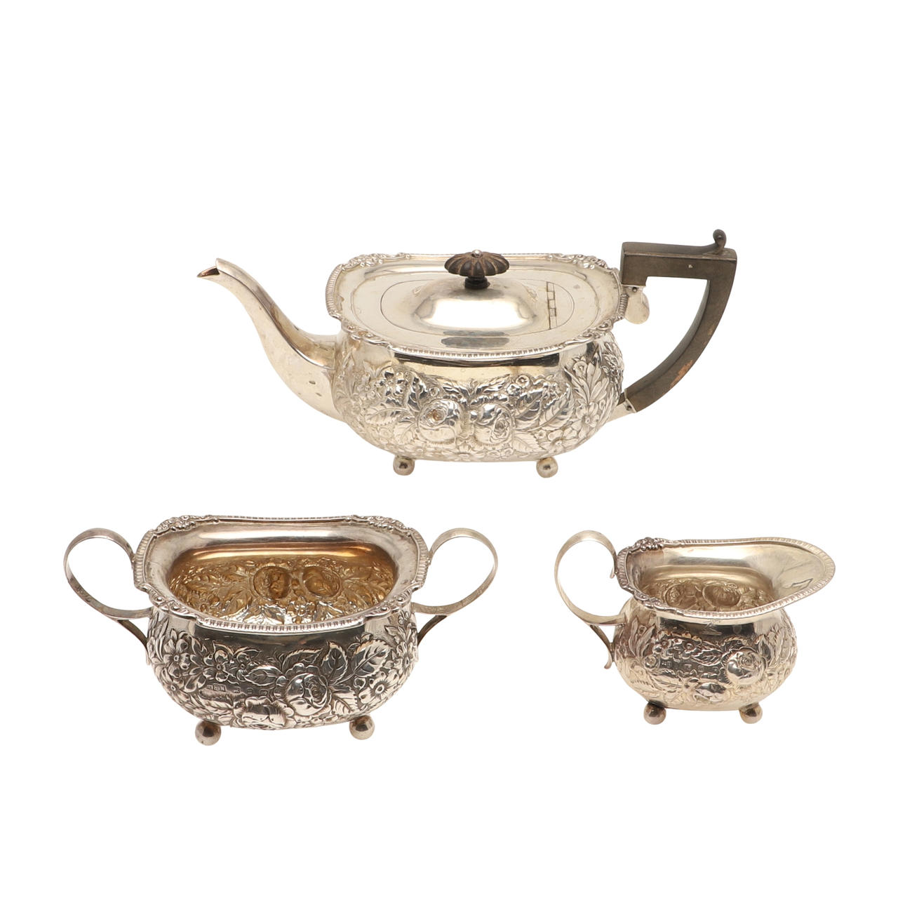 A LATE VICTORIAN SILVER THREE PIECE TEA SET.
