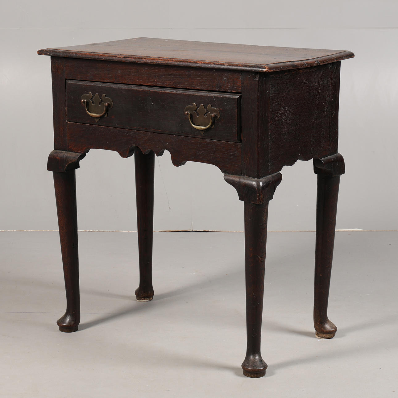 A GEORGE III OAK LOWBOY.