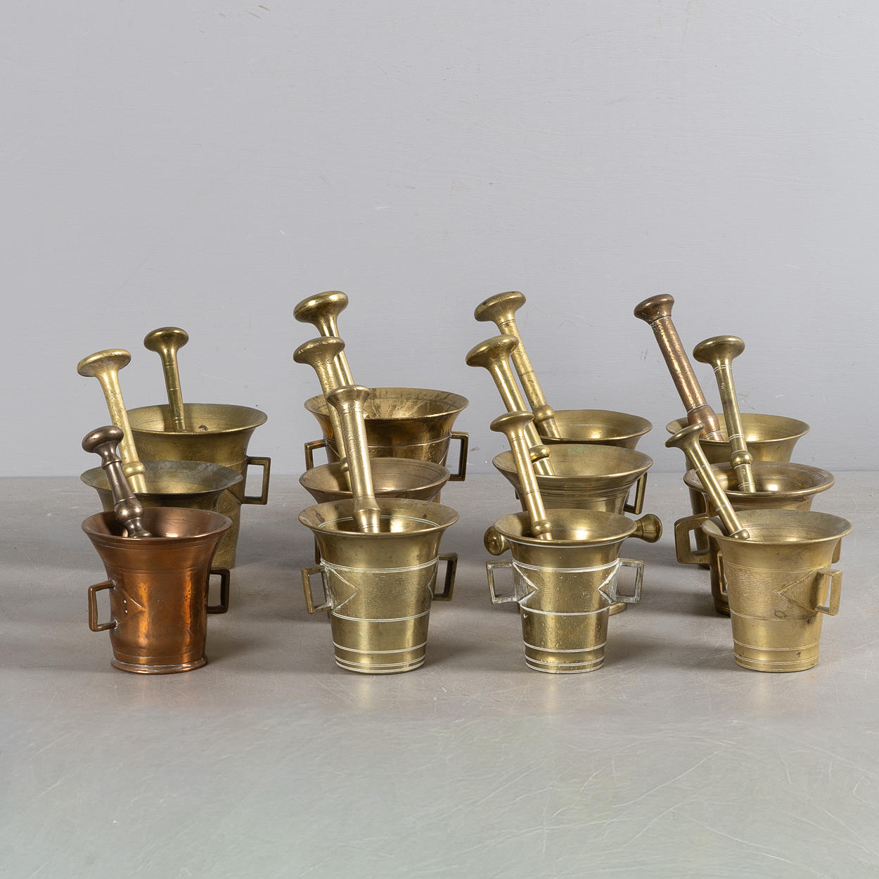 12 brass mortars, 17th/19th century.