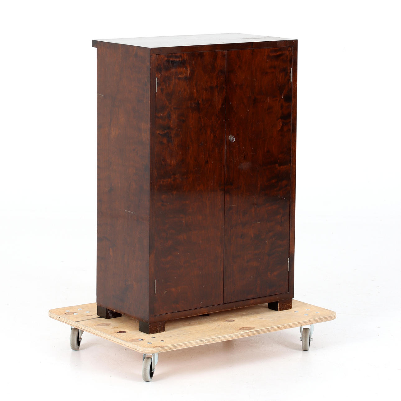 A stained birch cupboard, 20th century.