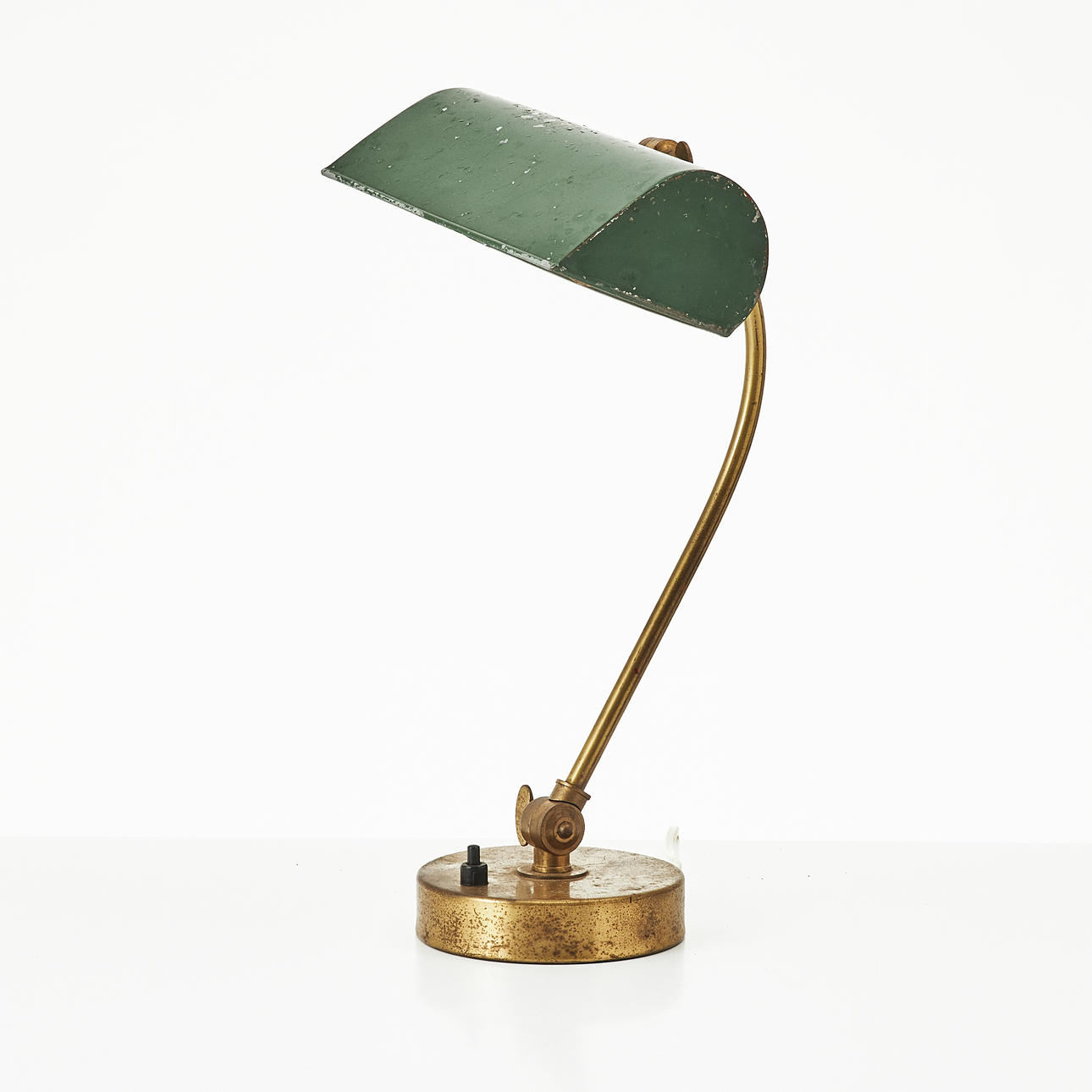 A table lamp, brass, 1930s, metal screen, adjustable shade.