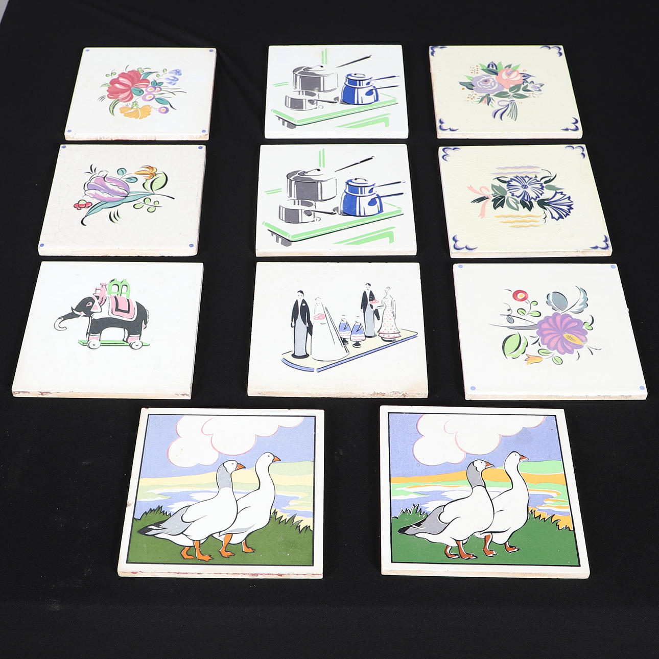 ELEVEN ASSORTED CARTER POOLE POTTERY TILES.