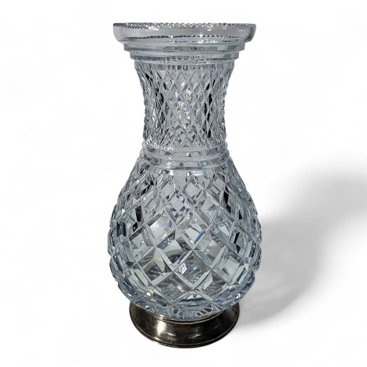 Carved glass vase with silver base.