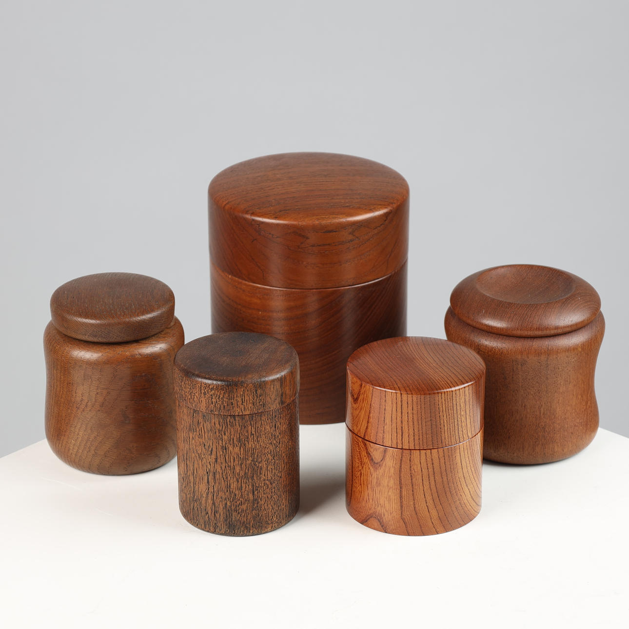 A collection of containers of turned wood, teak, oak and elm, Denmark ...