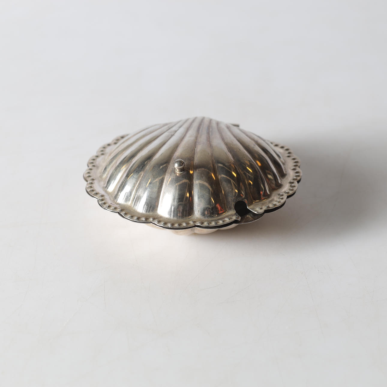 A caviar shell, nickel silver, 20th century.