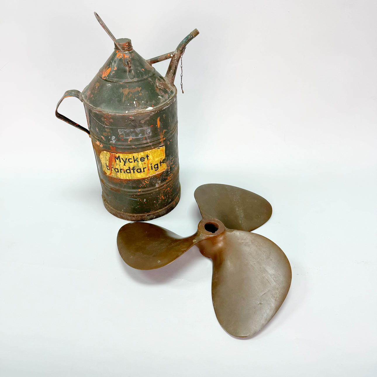 BRASS PROPELLER & KEROSENE JUG.
