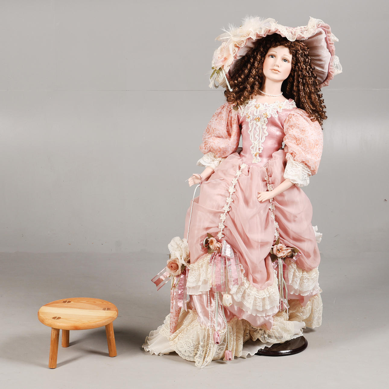 A LARGE PORCELAIN DOLL.