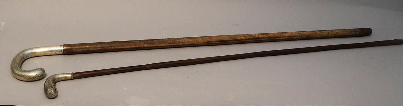 STICKS, two pieces with silver handles.