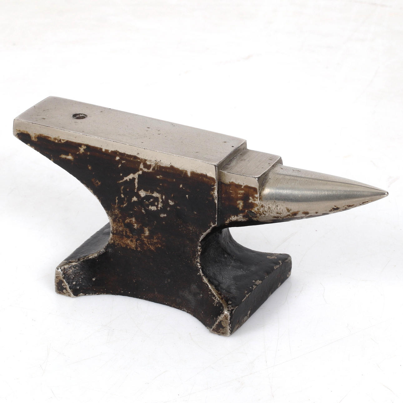 A 20th-century iron miniature anvil. Silver & Metals - Other 