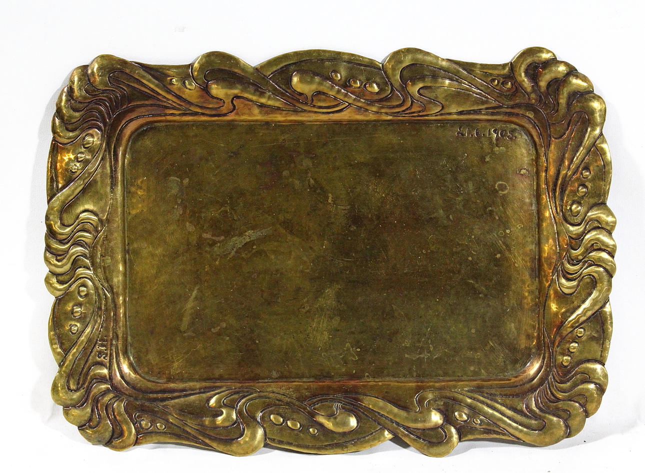 BRICKA, mässing. signerad S.H daterad 1905.