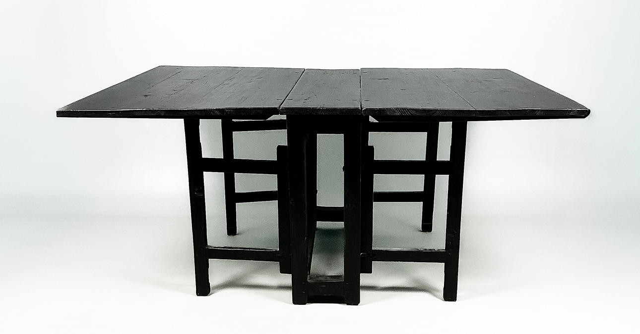 A black lacquered percussion table, 19th century.