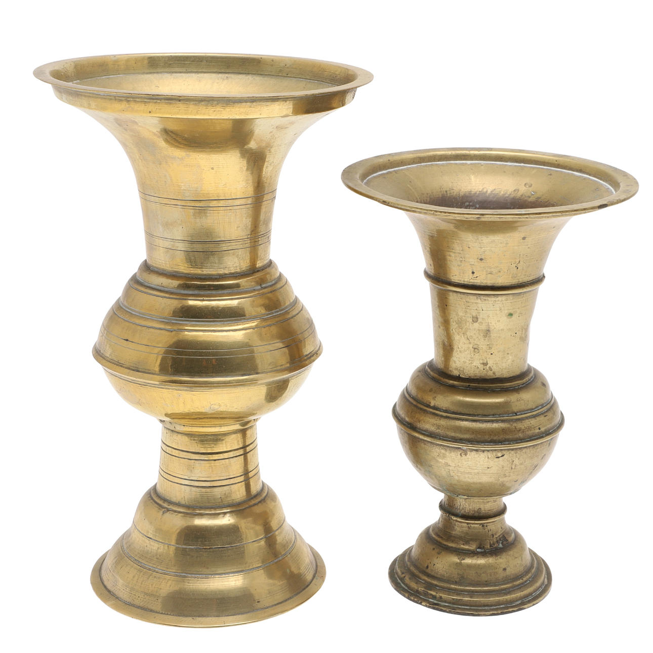 TWO JAVANESE BRASS SPITTOONS WITH FLARED RIMS.