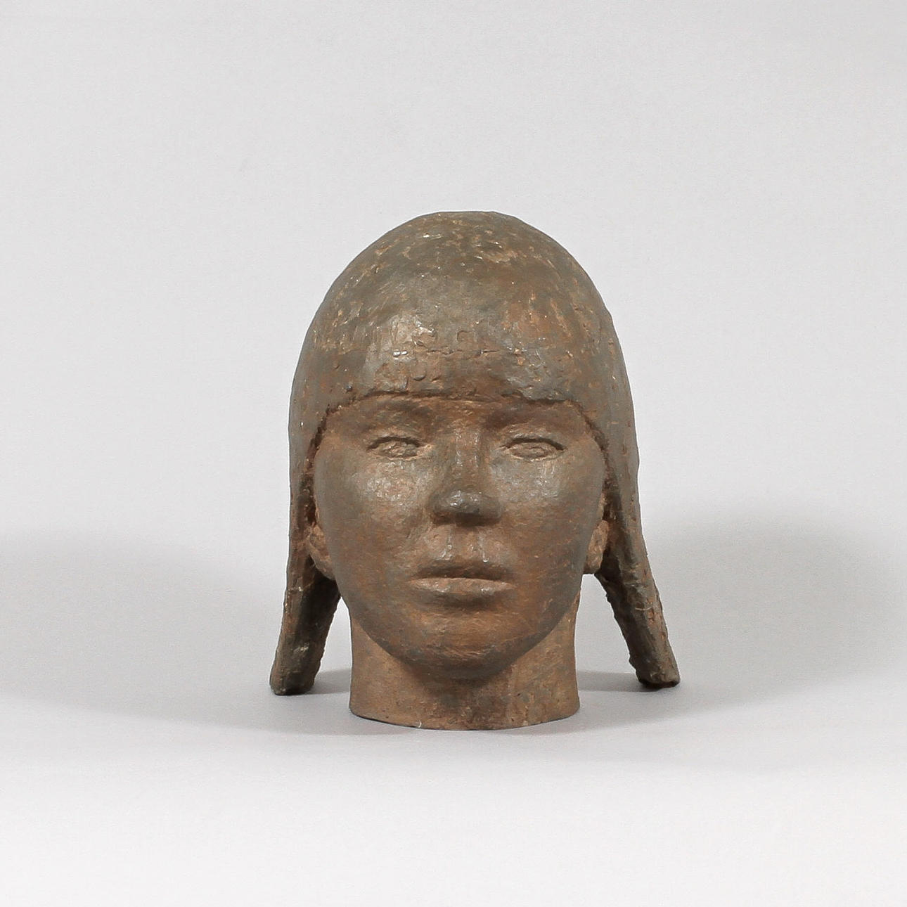 ERIK PERSSON. Skulptur, kvinnohuvud, patinerad metall.