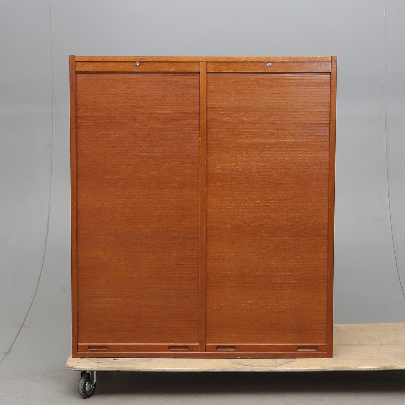 A mid 20th century blind/filing cabinet.