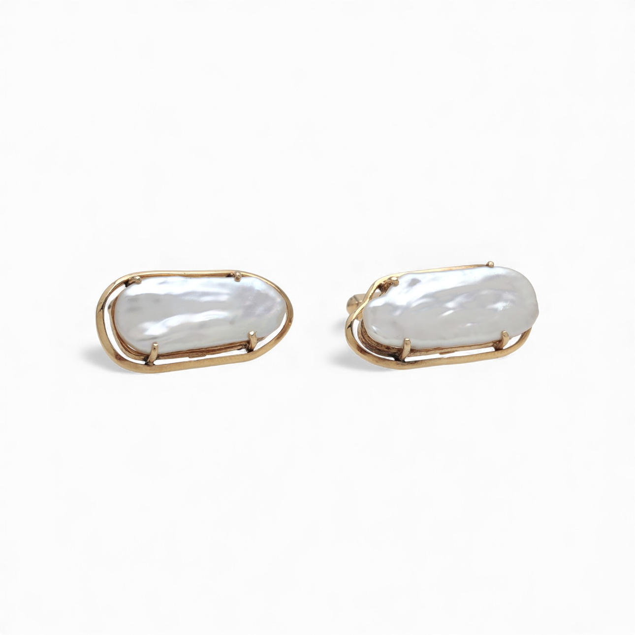 Gemelos en oro y perlas.