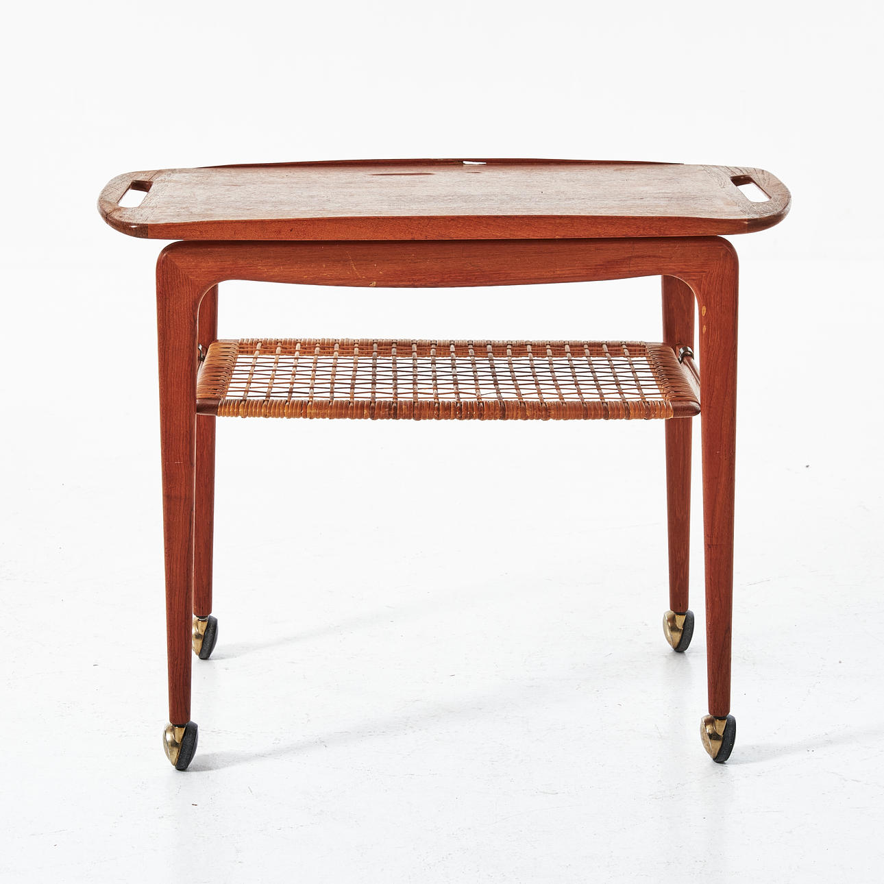 JOHANNES ANDERSEN. Serving trolley, Silkeborg, solid teak, shelf with wicker rattan. Labelled.