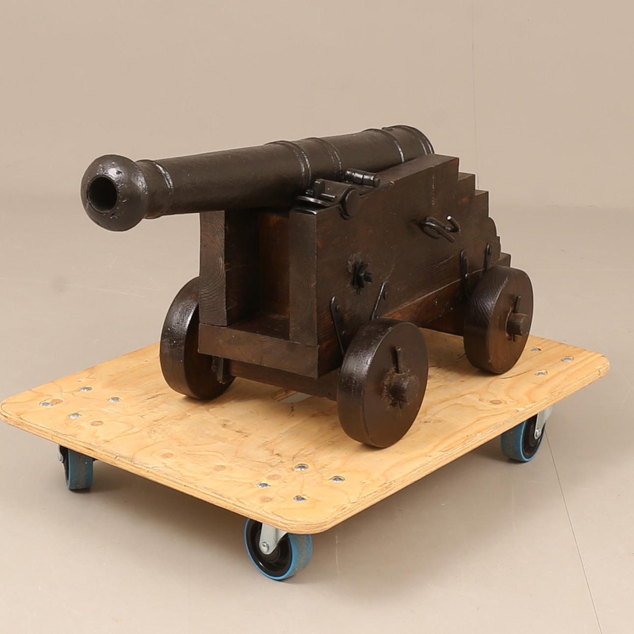 A contemporary 18th century model cannon, wooden baton and composite ...