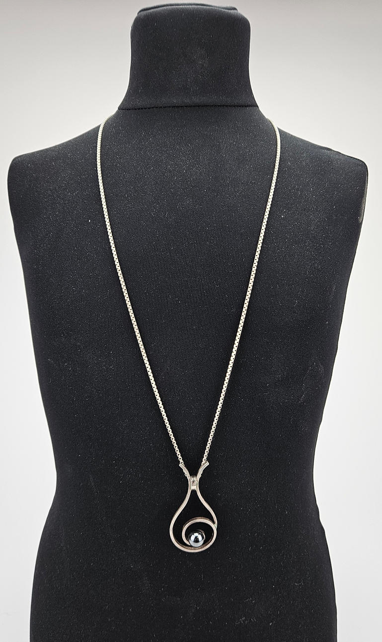 A SILVER PENDANT, Stigbert, 1972 and a silver chain.