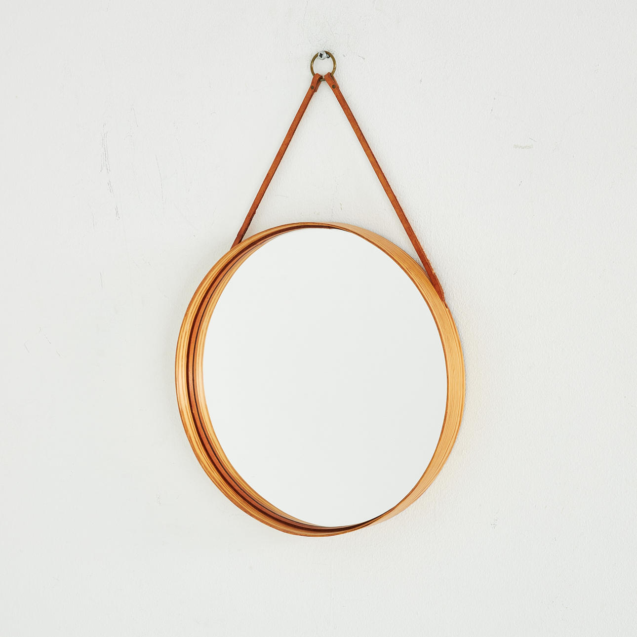 MIRROR. Glasmäster Markaryd, no 102, pine, leather strap, label marked.