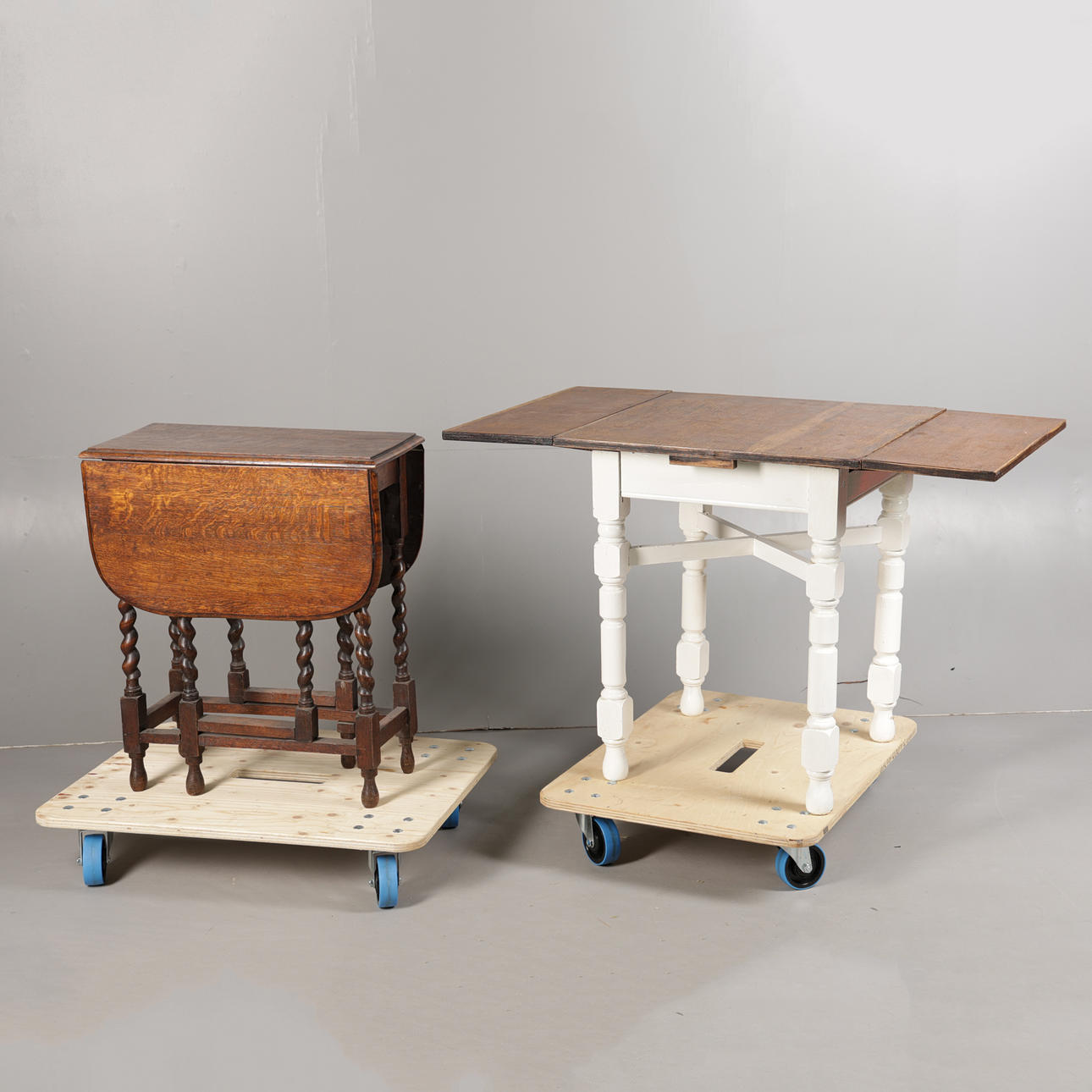 AN OAK DRAWER LEAF TABLE TOGETHER WITH A DROP LEAF TABLE (2).