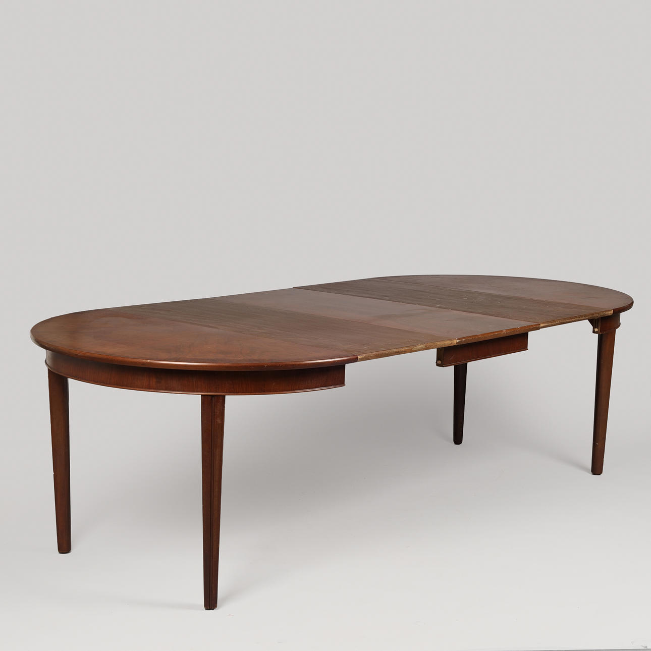 Mahogany circular table with pull-out and three additional plates, Danish cabinetmaker, Denmark, first half of the 20th century (1+3).