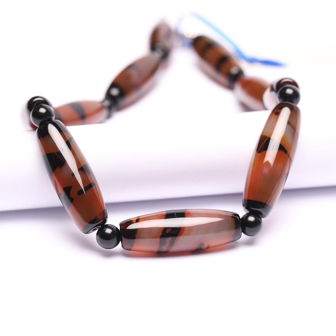 A necklace, agate, silver clasp.