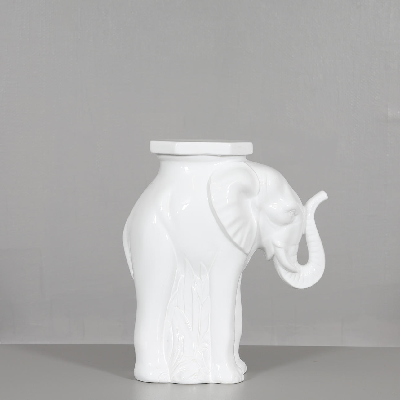 PEDESTAL, glazed ceramic "elephant”.