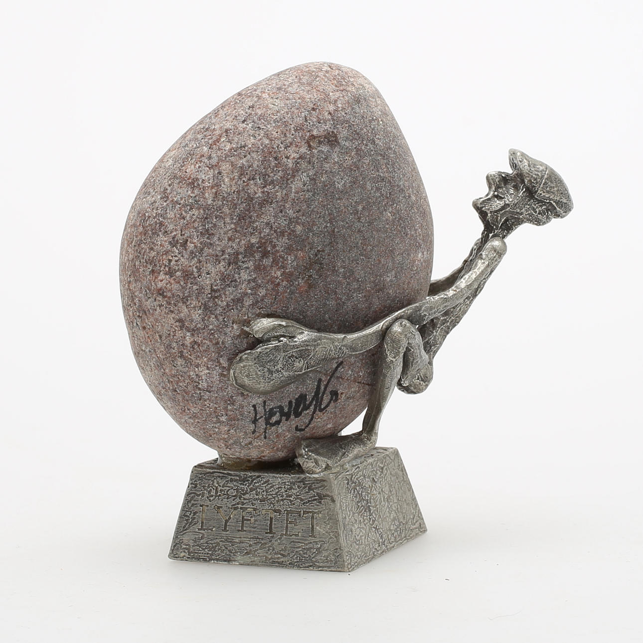 HENRY GUSTAFSSON. "Lyftet", skulptur, tenn och sten, signerad.