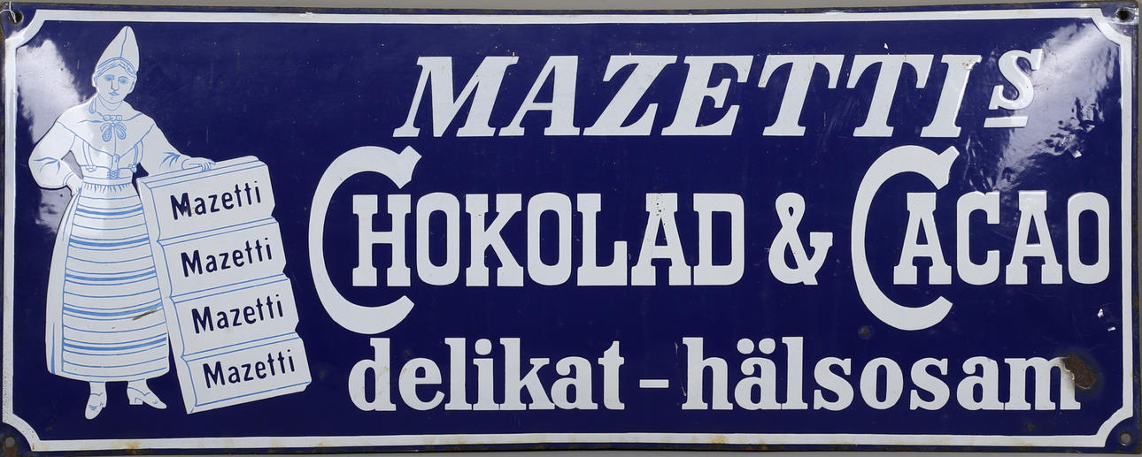 REKLAMSKYLT, emalj, 'Mazettis Chokolad & Cacao', 1900-talets första del.