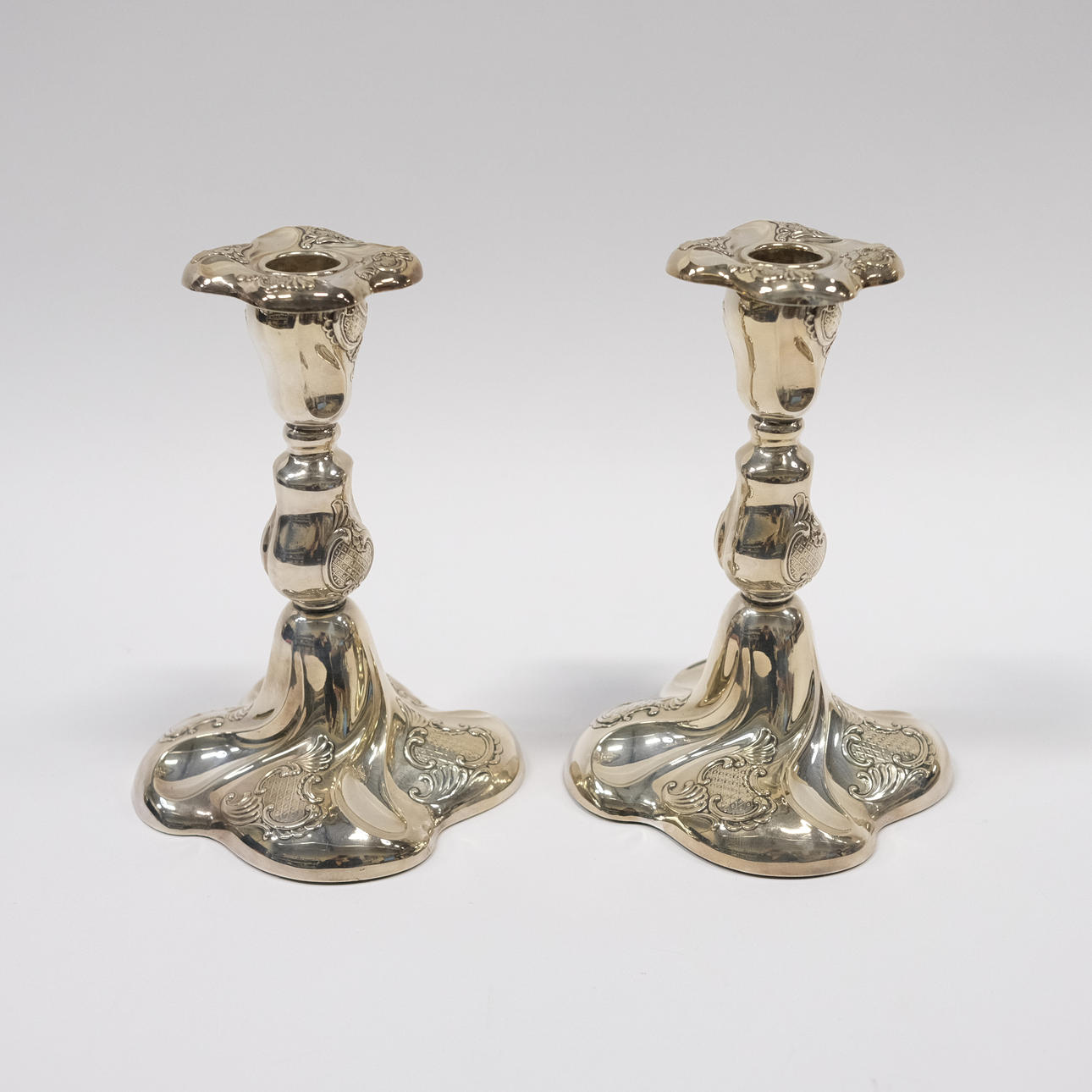 A PAIR OF CANDLESTICKS, SILVER, ROCOCO STYLE.