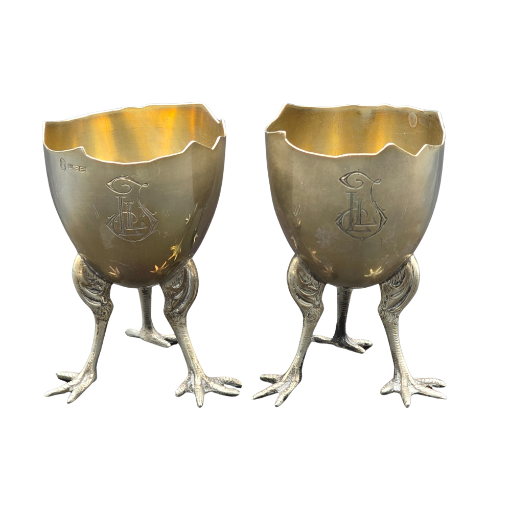 TWO SILVER EGG CUPS PUNCHED WITH CROW'S FEET.