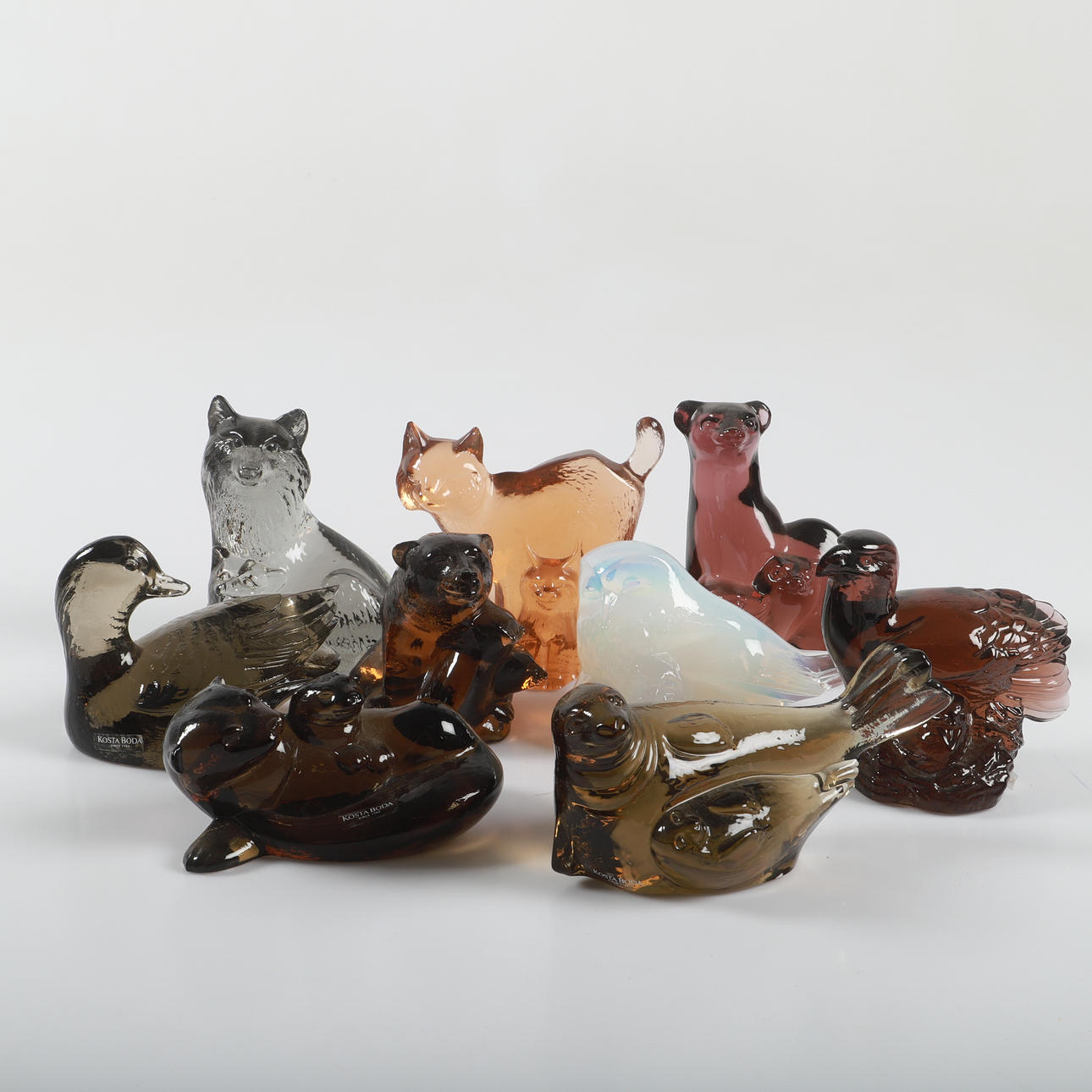 PAUL HOFF. Figurines, 9 pieces, glass, Kosta Boda for WWF, signed