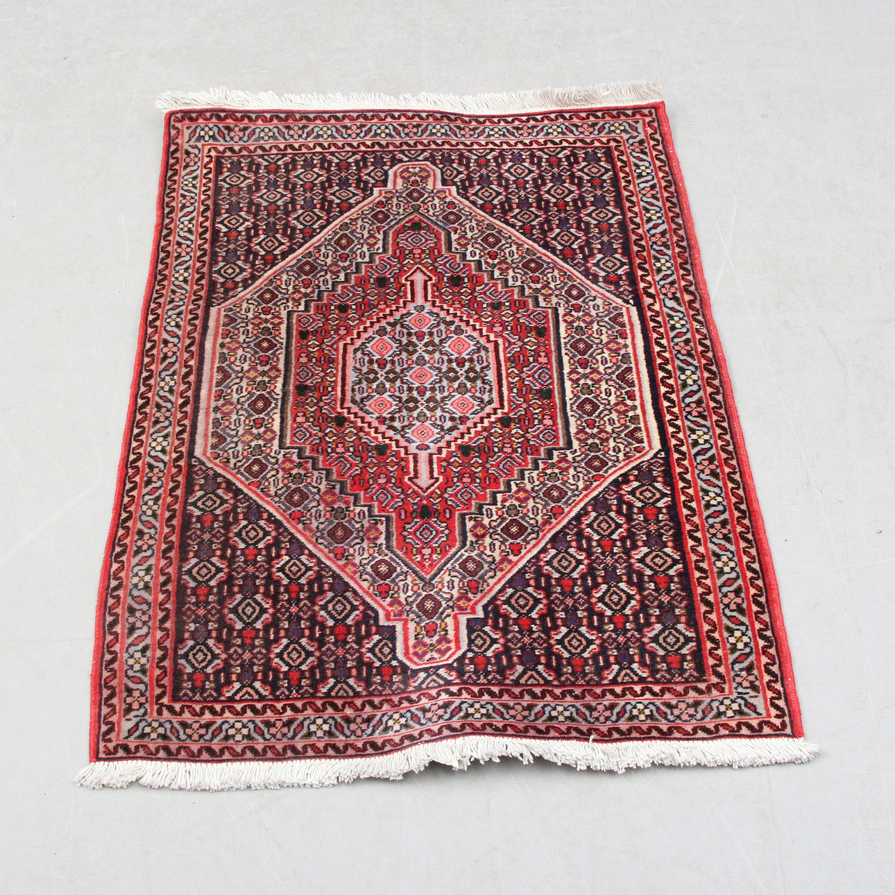 A CARPET, Oriental, red. 75x110.