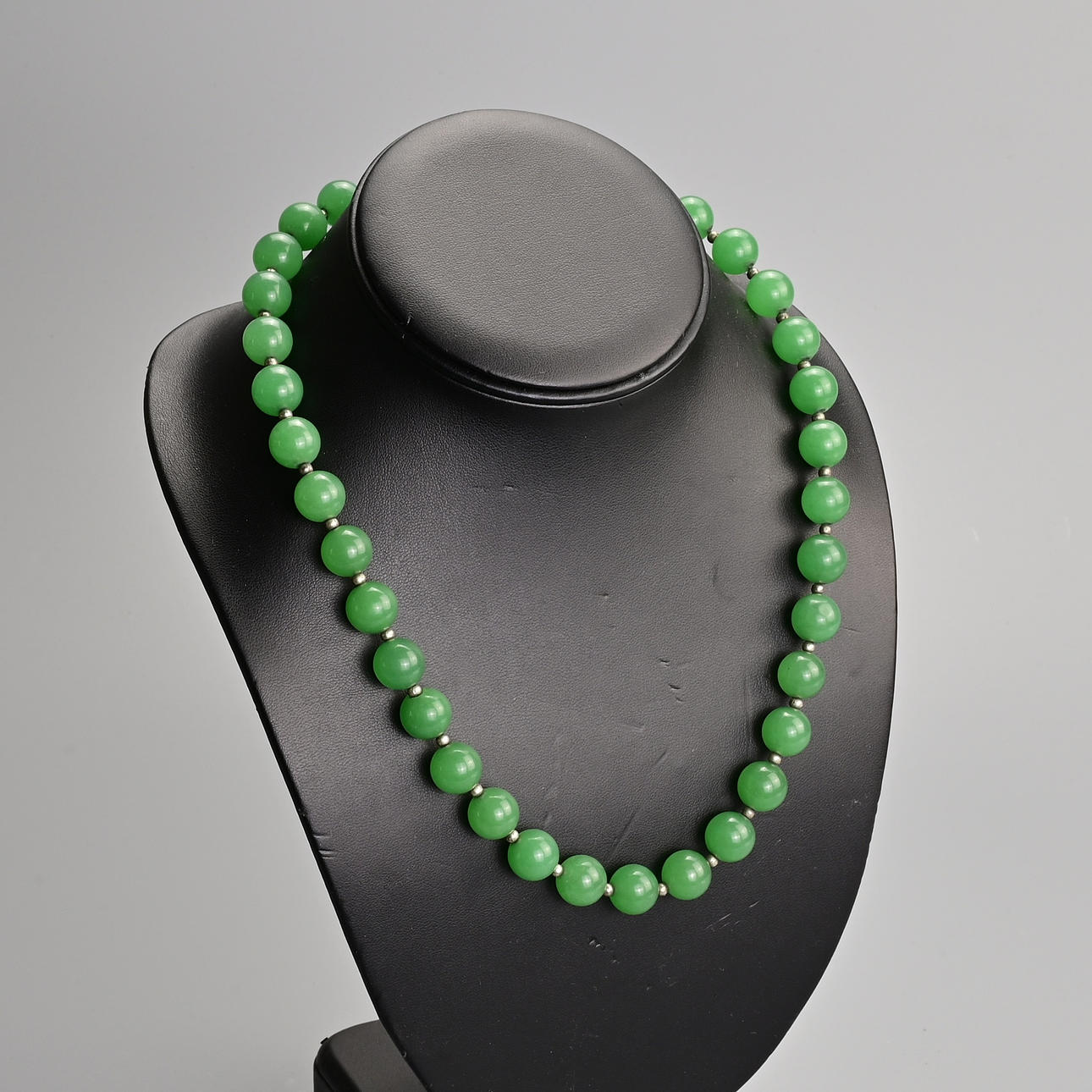 TWO GREEN STONE BEADED NECKLACES TOGETHER WITH ONE OTHER STRING OF ...