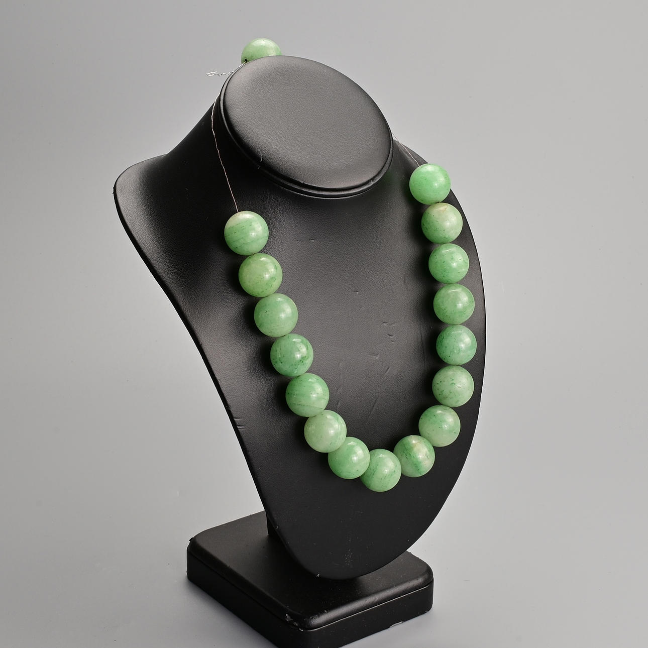 TWO GREEN STONE BEADED NECKLACES TOGETHER WITH ONE OTHER STRING OF ...