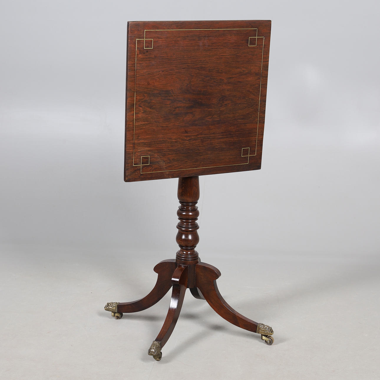 A REGENCY STYLE BRASS INLAID TABLE.