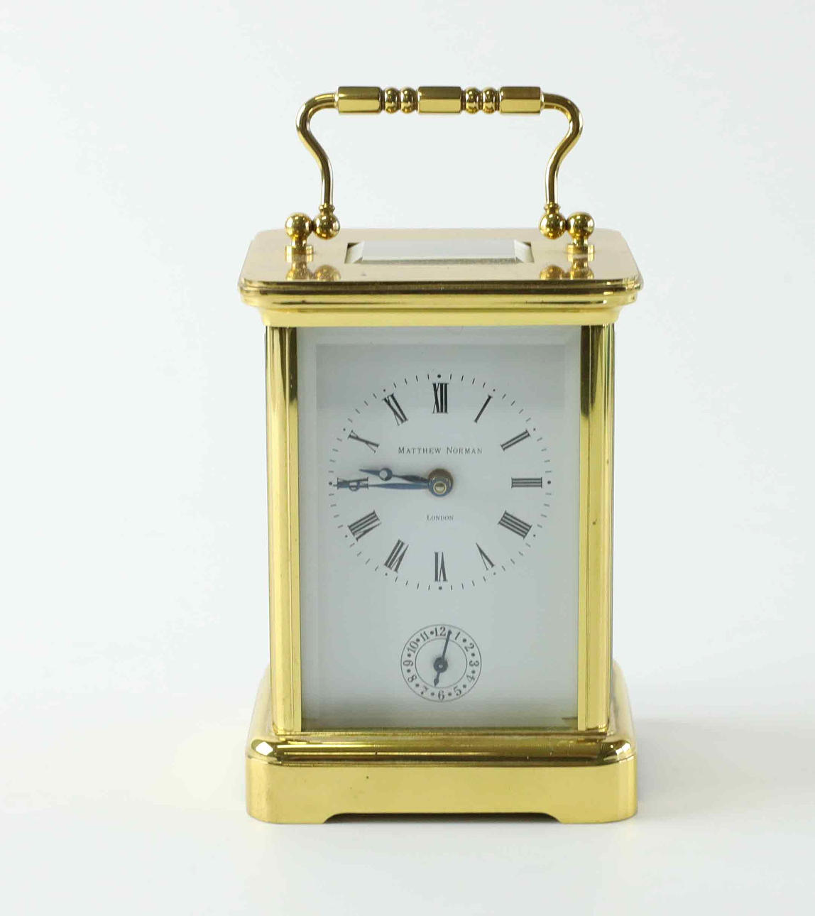 Matthew Norman, a brass travel alarm clock/alarm clock, England
