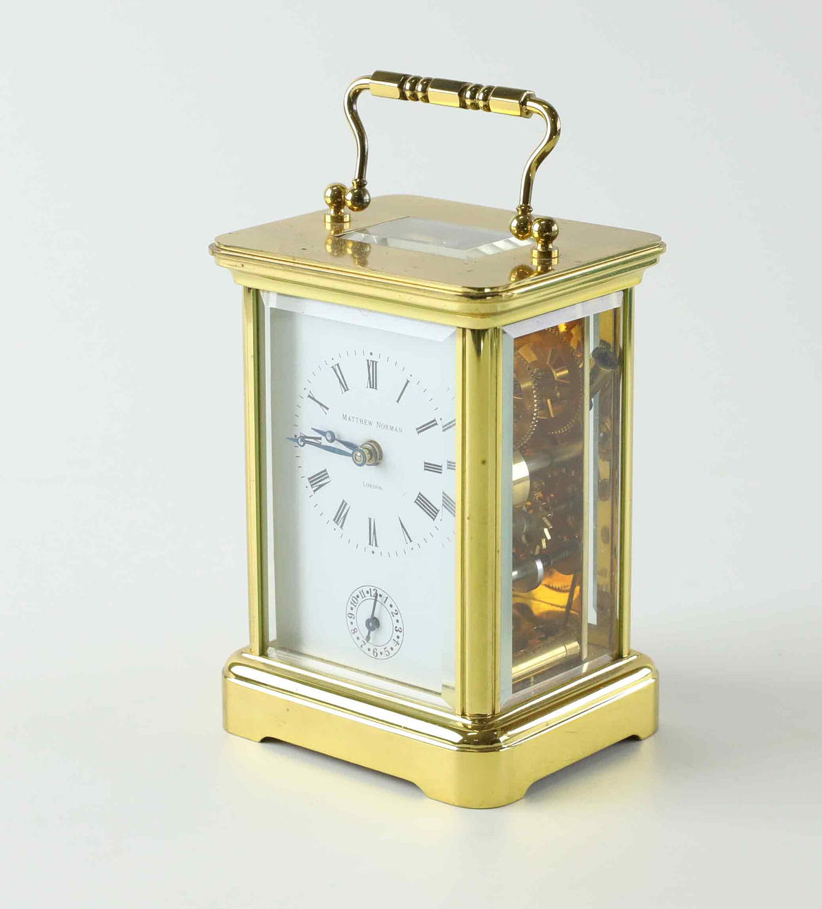 Matthew Norman, a brass travel alarm clock/alarm clock, England