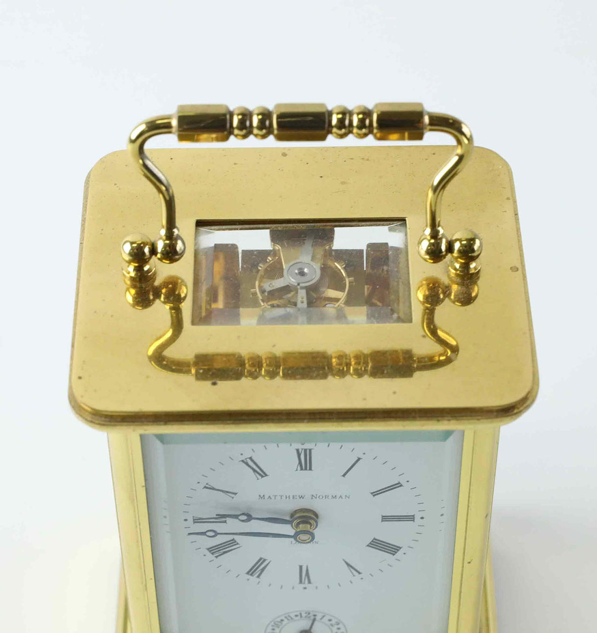 Matthew Norman, a brass travel alarm clock/alarm clock, England
