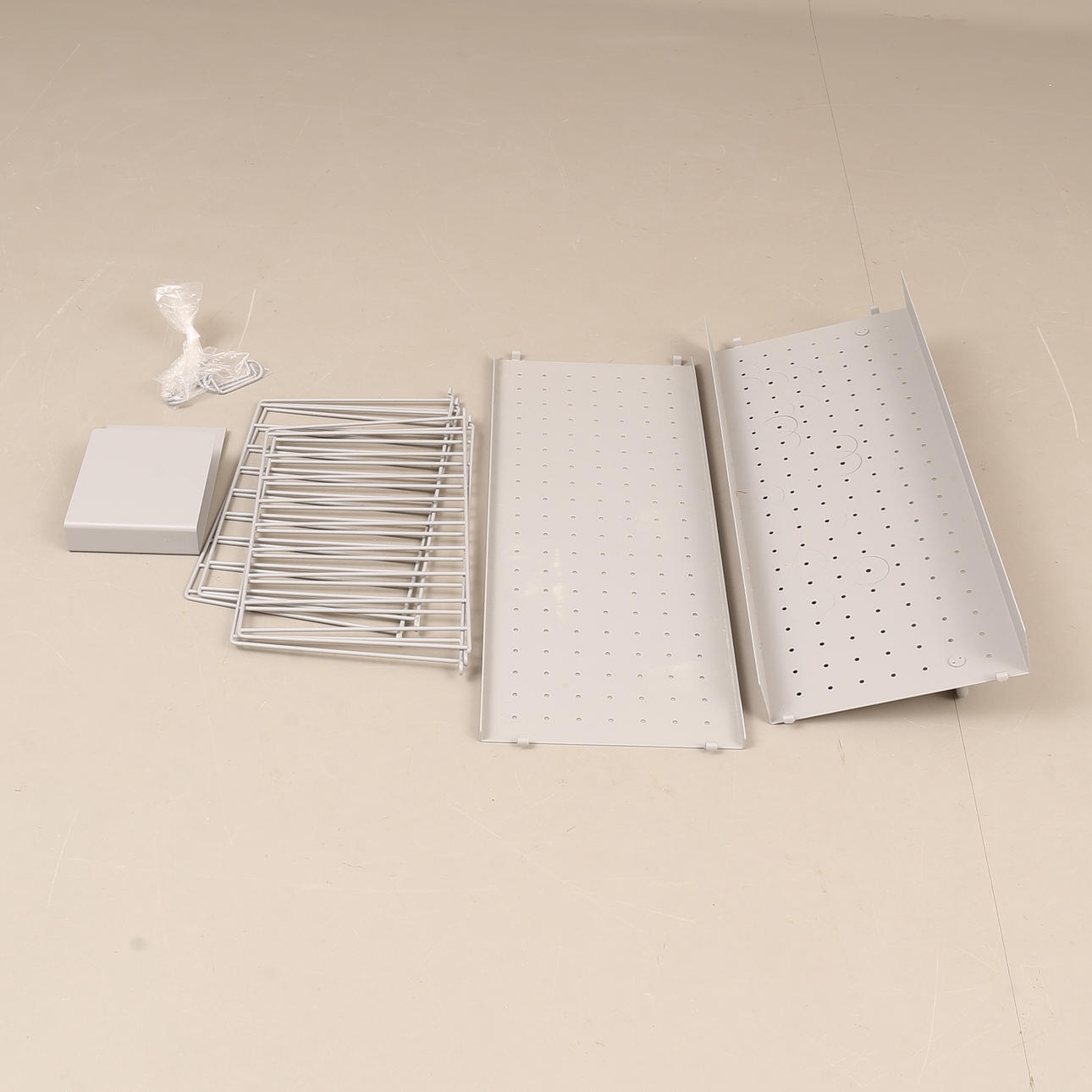 A metal shelf, marked String, 2000's.