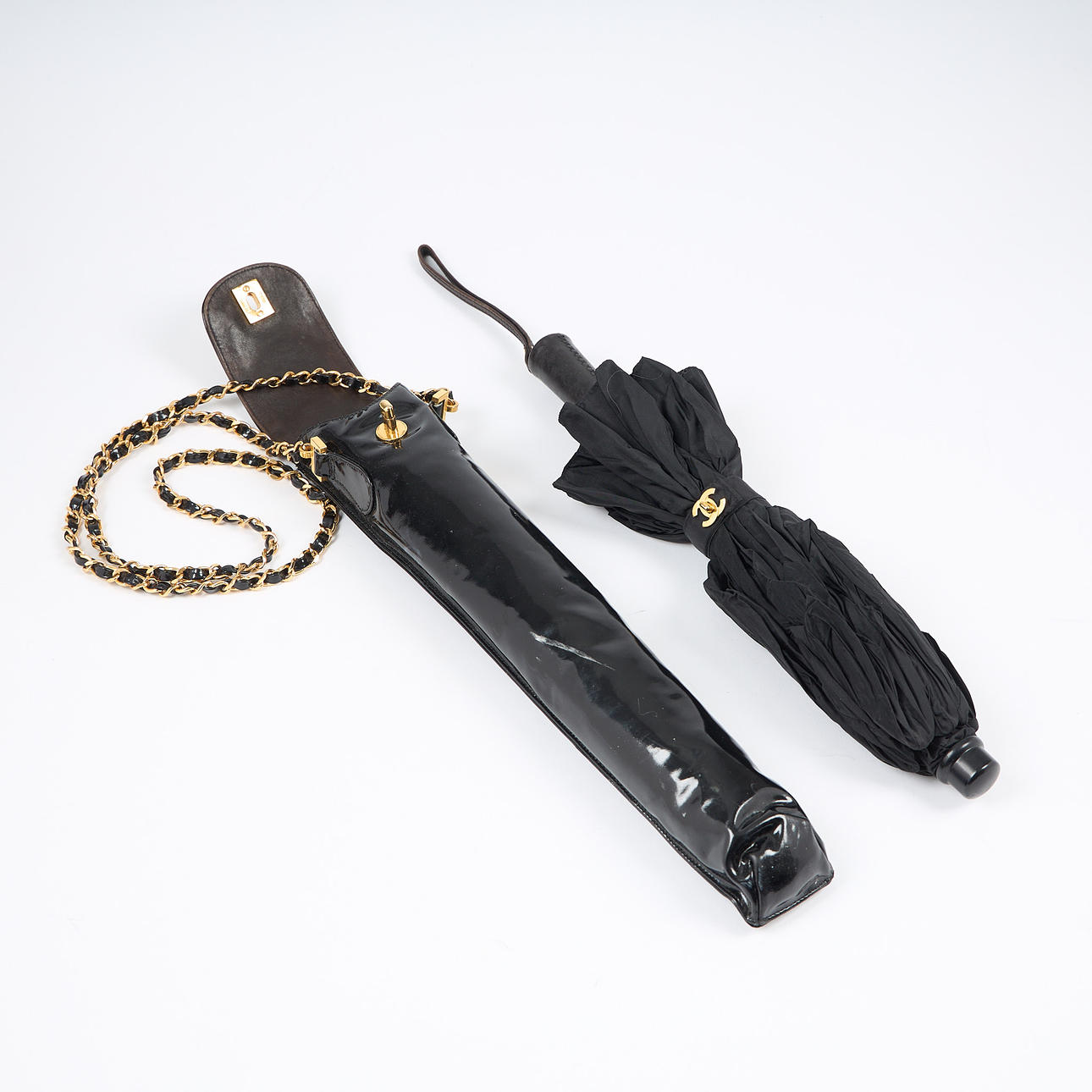CHANEL, an umbrella in a case, 1990s.