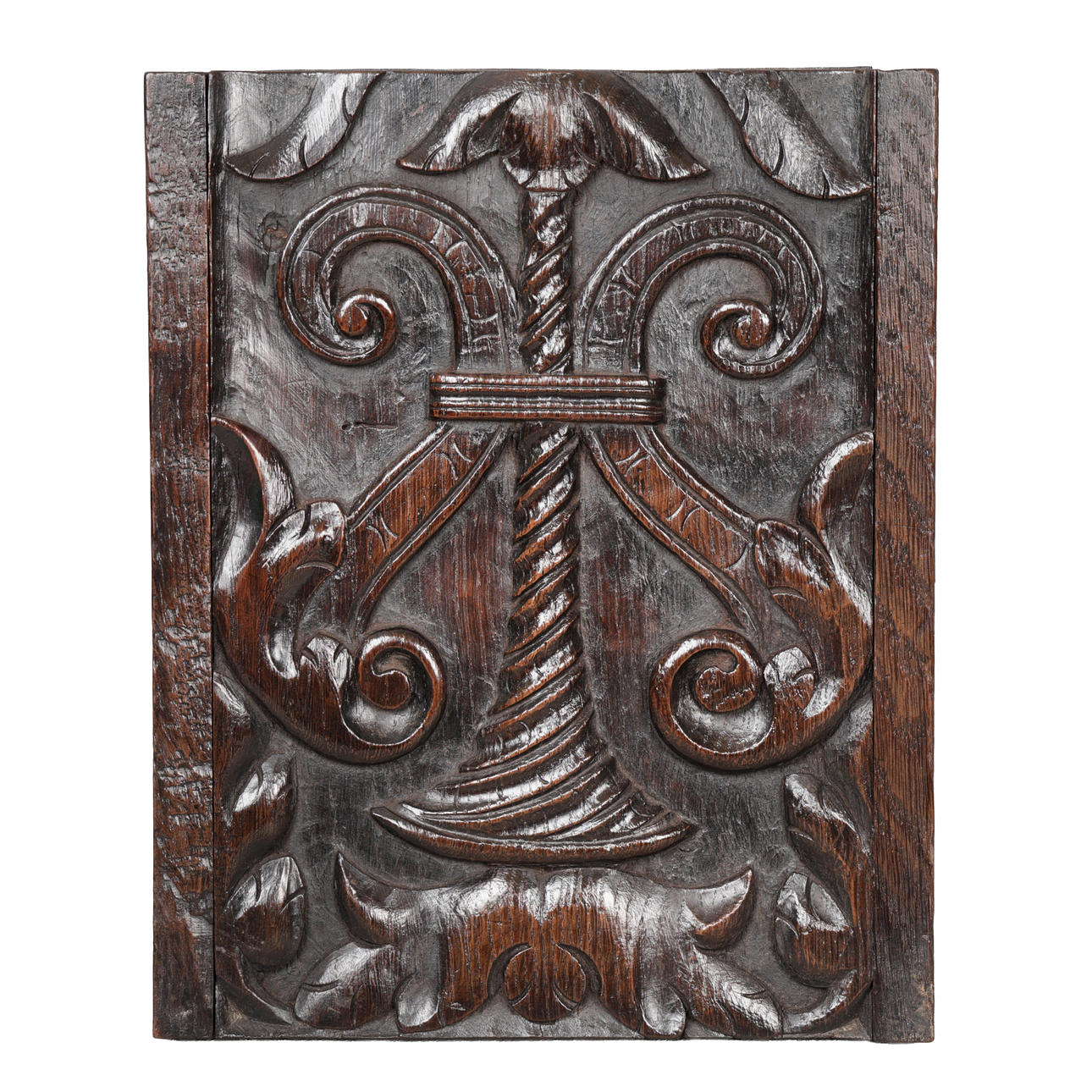 A 16TH CENTURY CARVED OAK PANEL.