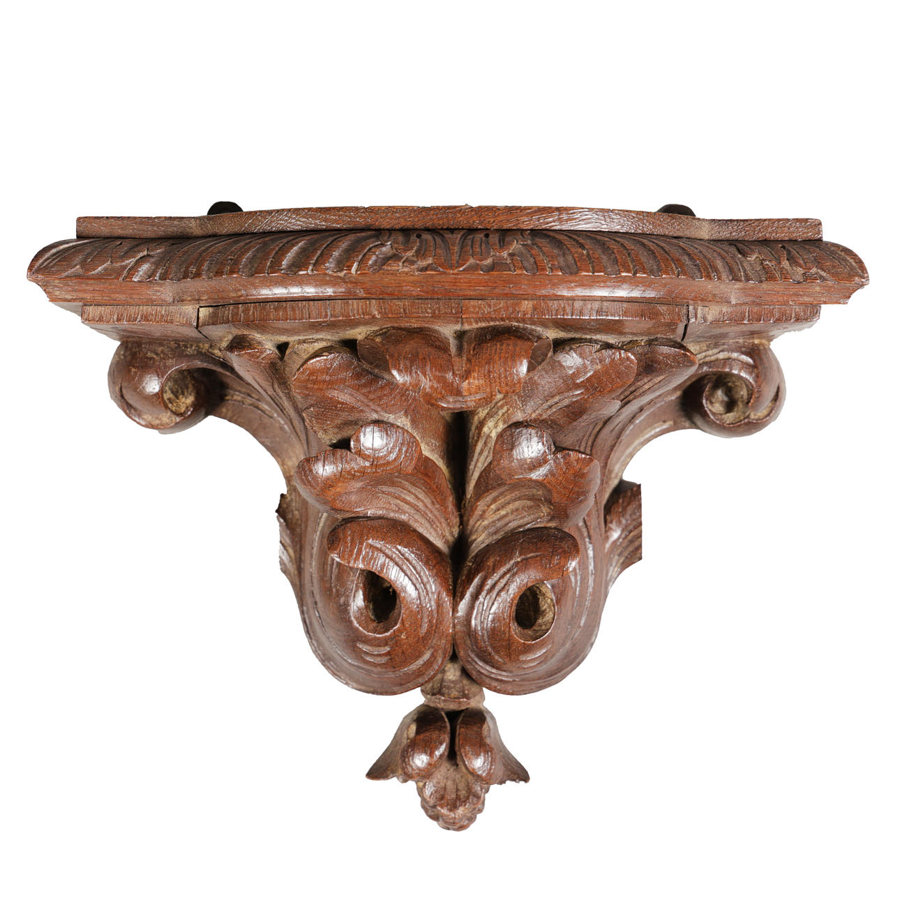 A WILLIAM AND MARY CARVED OAK WALL BRACKET.