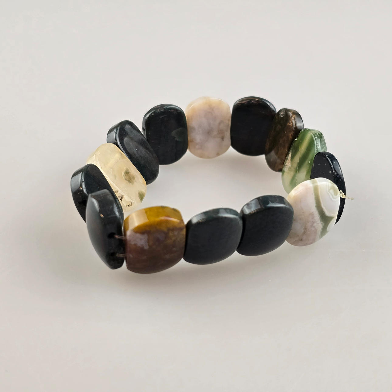 JADE BRACELET - 14 rounded elements, different colors, finely polished.