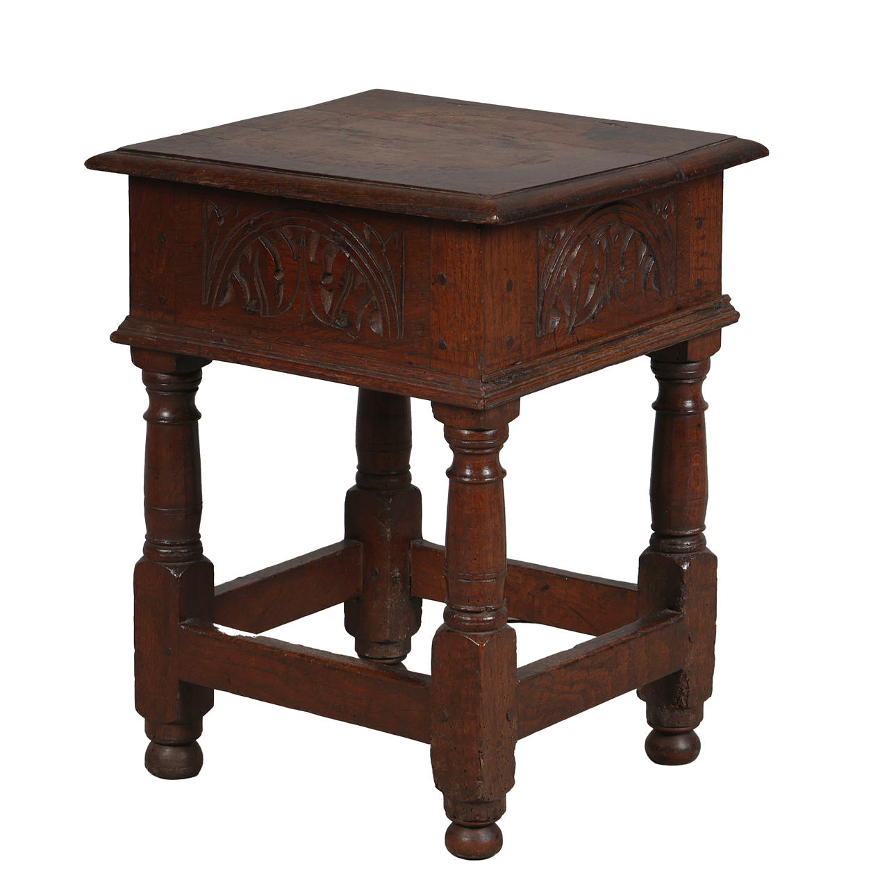 A GOOD 17TH CENTURY CARVED OAK BOX STOOL.
